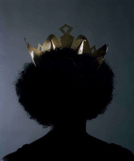 A gold crown resting on a natural afro — the Sanyu ideal made literal