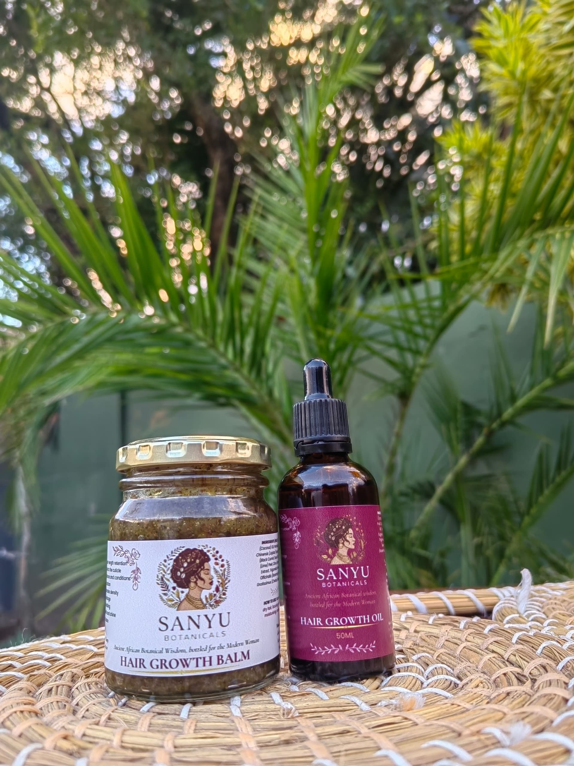 The Sanyu Ritual Duo — Signature Oil and Hair Growth Balm in golden light